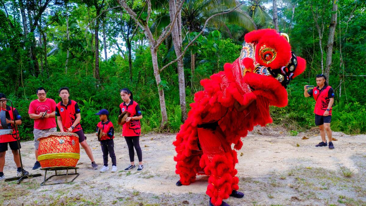 FIERY PERFORMANCE: The red lion, Lord Guan - God of War, wards off evil spirits during Chinese New Year celebrations on Christmas Island.