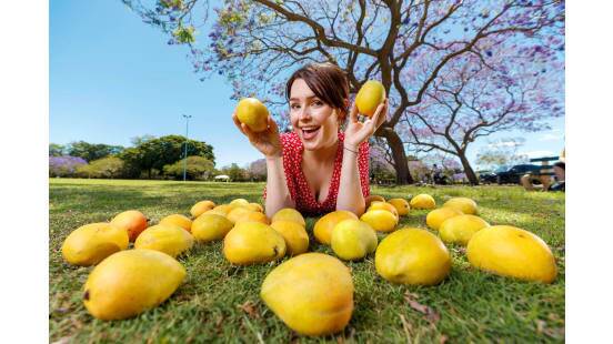 Beth Davis from Harris Farm Markets celebrates the beginning of mango season. Picture by Josh Woning