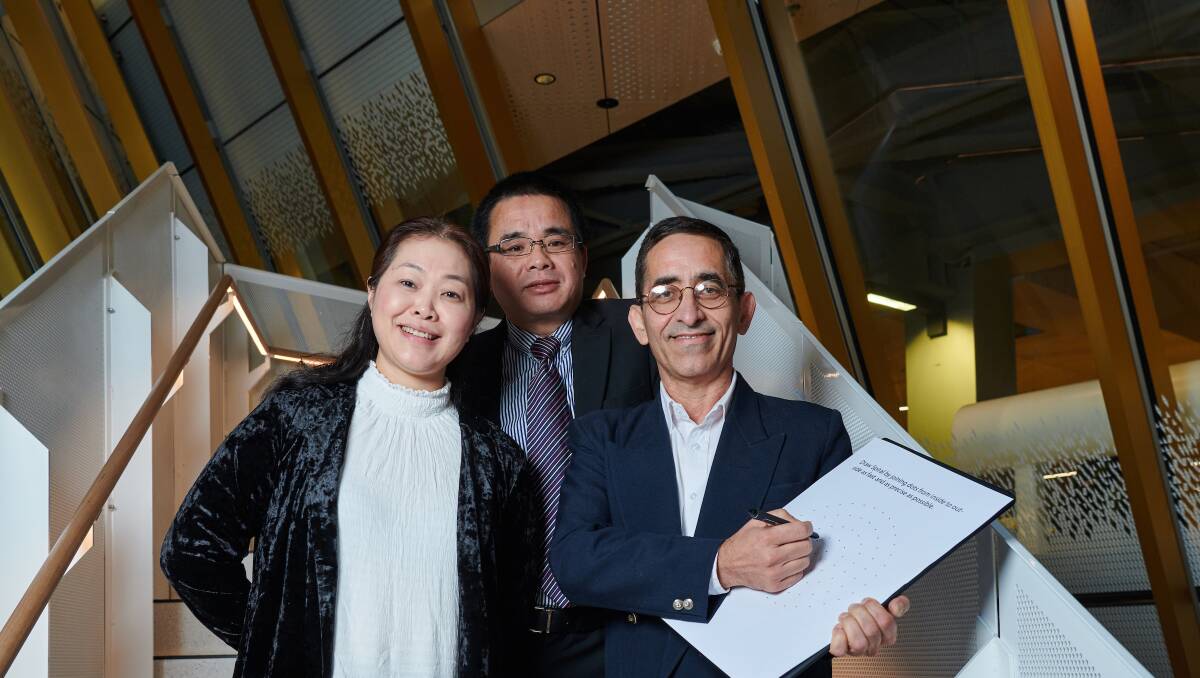 From left: Jesse Medical director Chenghong Li and chief executive Jianpeng Zhai with RMIT's Professor Dinesh Kumar.