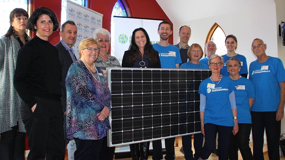 DYNAMIC: Noreen Nicholson (front, second from right) and Geelong Sustainability members with MLA Christine Couzens (centre) and staff from Multicultural Aged Care Services celebrate the installation of the solar panels.