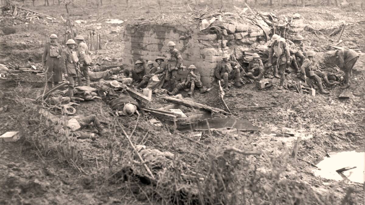 Exhausted troops slump in the battlefields of western Europe.