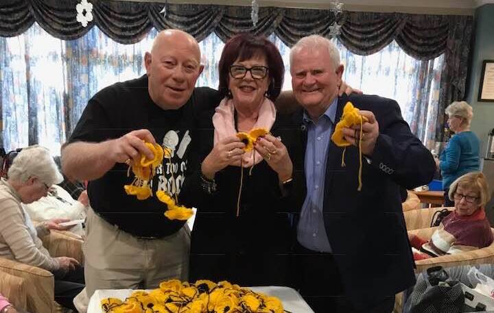 HAND-MADE: Volunteers crocheted more than 1250 black and yellow poppies to show their support for athletes.