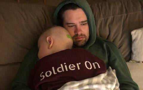 HOPE: Archer while undergoing chemotherapy in 2019, with his dad. Photo: Claire Bermingham.
