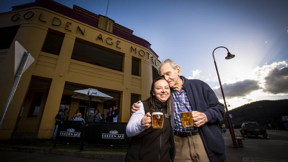 OPEN DOORS: Hannah Richard who runs the Golden Age Hotel, Omeo enjoys a beer with her grandfather Bob Richards 91. 