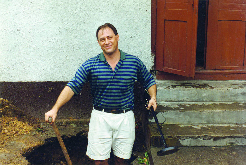 Tony Bernard digging for buried valuables at the family's former home in Poland. Picture: Supplied