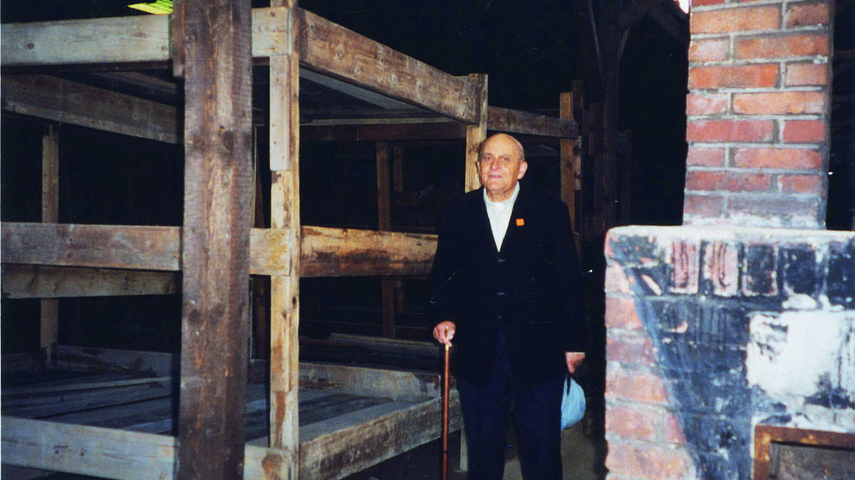 Henry Bernard by his bunk in Auschwitz. Picture: Supplied