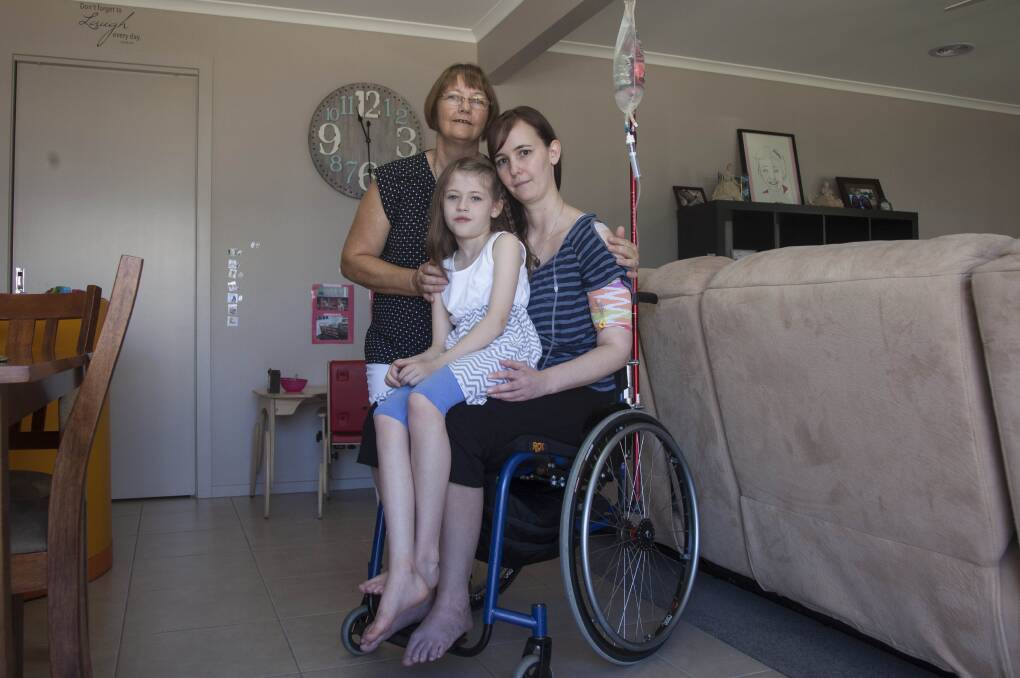 FAMILY SUPPORT: Tracey Roberts and her daughter Olivia live in a purpose-built home in the back yard of the Redan home of her parents Carmel and Jeff Lusk. Picture: Mark Smith