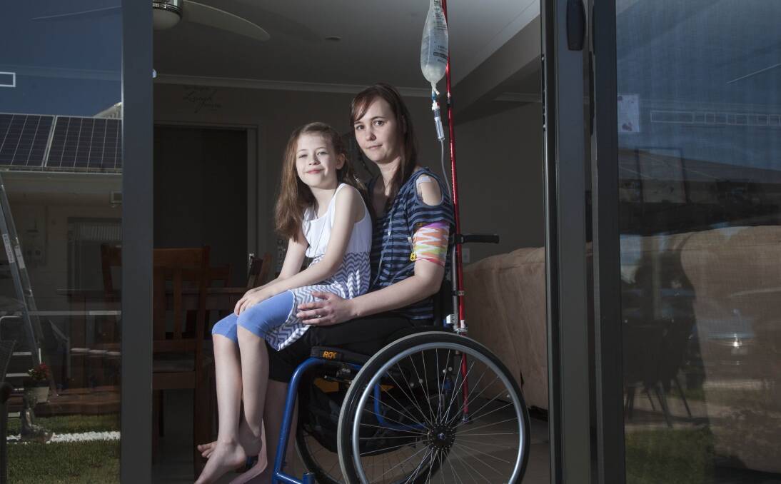 DENIED: Tracy Roberts needs a motorised wheelchair to allow her to leave the house on her own or with daughter Olivia, 8, but the NDIS says she's not disabled. Picture: Mark Smith