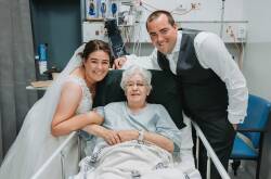 Alicia and Jacob Hinkley visit her grandma Dawn Drake in Warrnambool hospital on their wedding day. Picture by Josh Beames