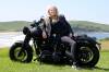Sandy Norse, founder of Twin Peak Riders Group, leaning on her Harley Davidson at Killalea. Pictures by Sylvia Liber