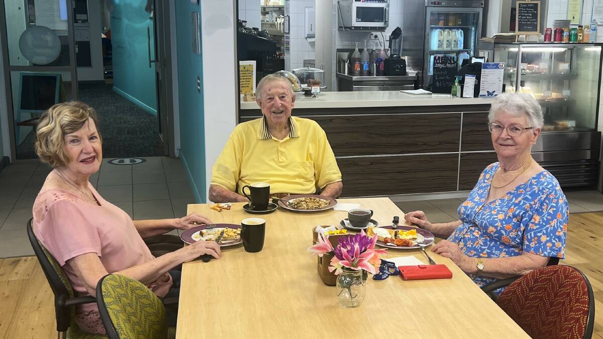 Alma Ronlund (at right) enjoying breakfast with friends Christine Burgess and Reg Wilson at the cafe at Azure Blue Retirement Village where she's now living after downsizing from her large family home. Picture supplied