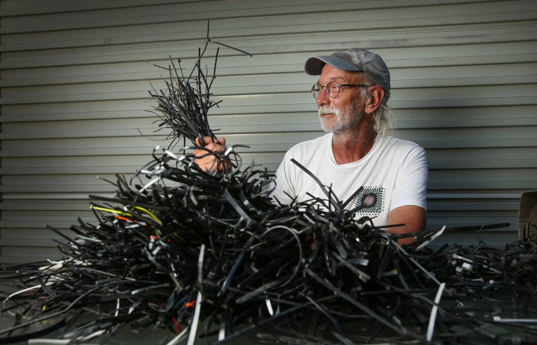 HAUL: Rusty Cherkas with the thousands of plastic cable ties he has collected during his walks around the city since May. Picture: Marina Neil 