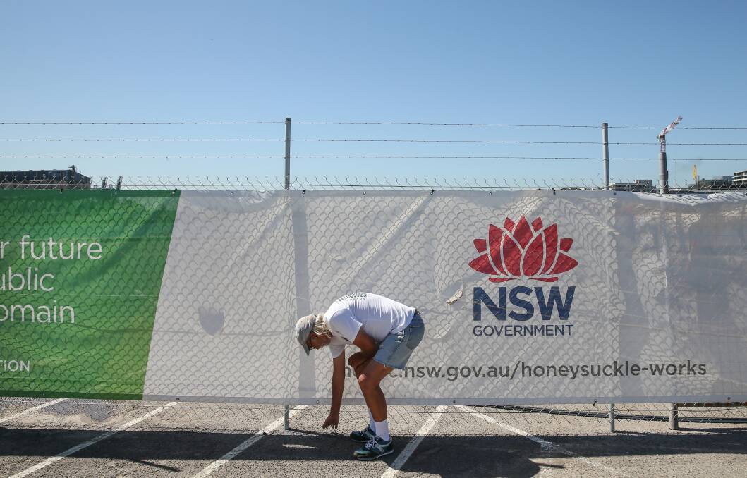 MISSION: Rusty Cherkas picks up a plastic cable tie near Honeysuckle Drive, by the harbour, during his daily walk. Picture: Marina Neil