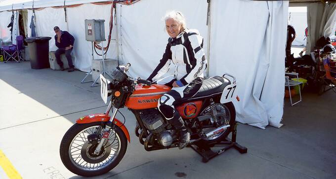 AT ONE WITH HER MACHINE – Margaret Moorhouse in the pits and on the track  during the Phillip Island Classic in 2015 aboard a 1972 Kawasaki H1B Triple.