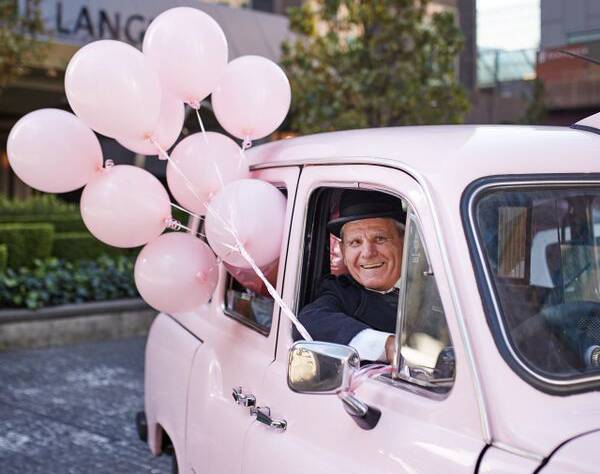 Laurie in The Langham's signature pink Rolls Royce.