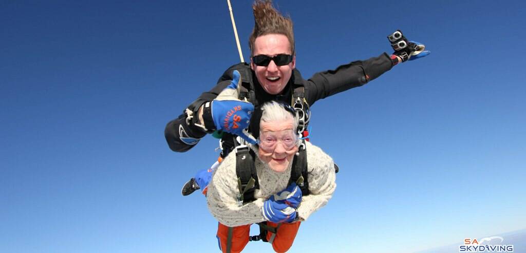 FLYING HIGH – Irene O’Shea flies into her second century with the help of instructor Jed Smith from SA Skydiving.