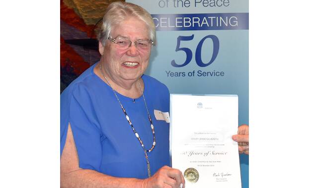 PROUD DAY –  Lesley Booth of Cromer in northern Sydney receives her award.
