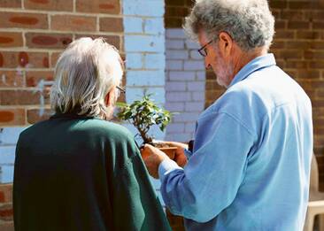 SMALL?PLEASURES?- The Sydney City Bonsai Club member with an inmate at Long Bay.