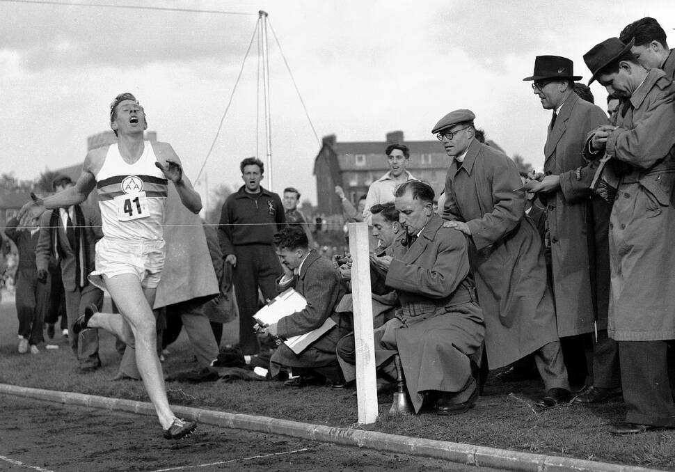 Roger Bannister hits the tape to become the first person to break the four-minute mile in Oxford, England. Photo: AP