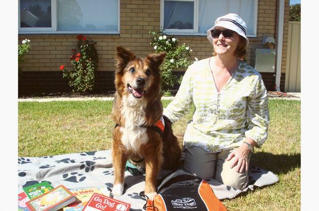 NOT?ONE?TO?WAG?- Tommy with Mary O'Donovan. As well as helping pupils with their reading, the friendly collie visits seniors at an aged care facility.