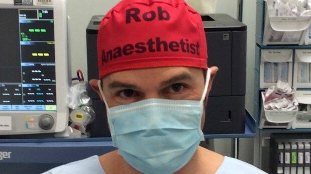 Sydney anaesthetist Dr Rob Hackett started wearing a red cap identifying him by his first name and position to reduce errors that could potentially be caused by staff not knowing their colleagues' names.  Photo: Supplied