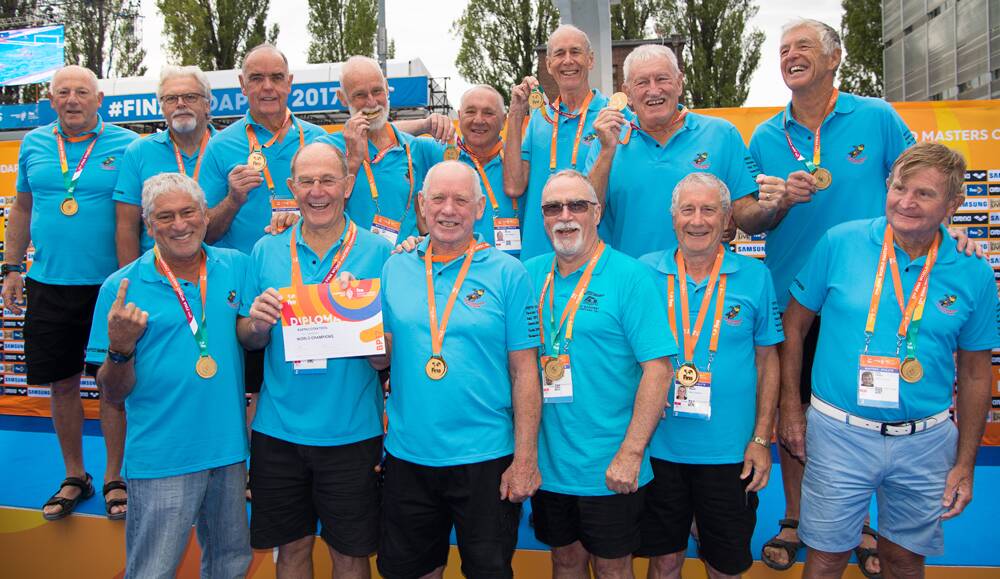FROM OUTSIDERS TO CHAMPIONS  – The Cockatoos with Gary Payne (top row, second from right) and captain Bill Wallace (front row, second from left) show off their medals.