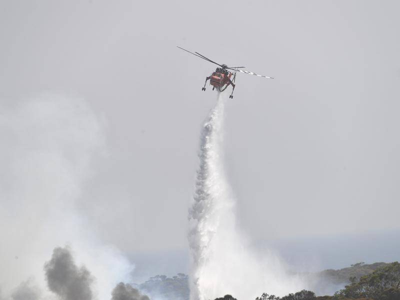 Water-bombing aircraft and ground crews continue to battle the Kangaroo Island bushfire.