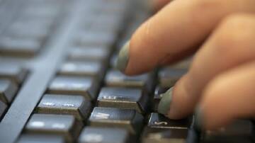 Australians made more 601,000 scam reports in 2023, up from 507,000 in 2022. (AP PHOTO)