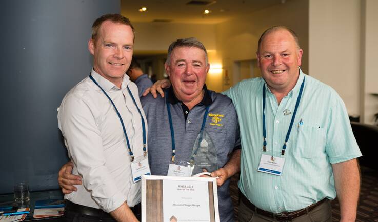 OUT OF THE ASHES – Wagga Wagga Men’s Shed president Peter Quinane (centre) at the national conference on the Gold Coast flanked by Barry Sheridan and  Eion Martyn from  the Irish Men's Shed Association.