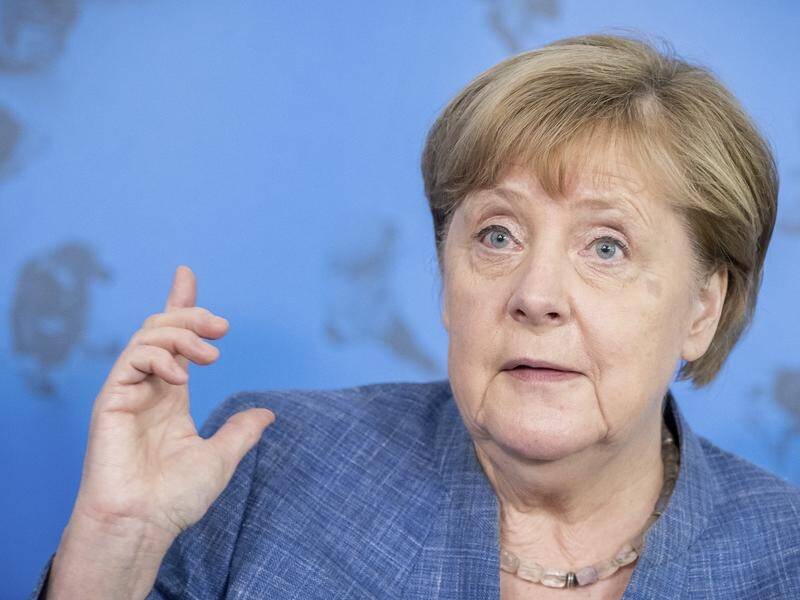 German journalists want Angela Merkel to intercede with Joe Biden on behalf of Julian Assange.