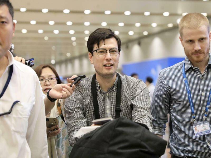 Australian student Alek Sigley arrived in Beijing after being released from detention in North Korea