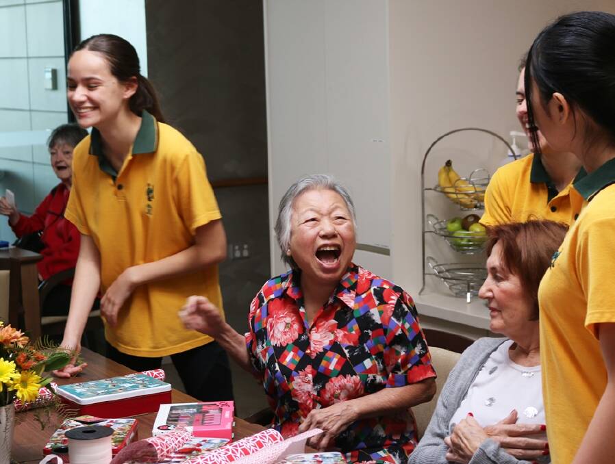 THAT'S A WRAP - (from left) MLC student Ella Amatulli shares a laugh with Mercy Place Mont Clare residents Miu Tsun Johnson and Sandra Watson and fellow students Madeleine Johnston and Zoey Yutong.
