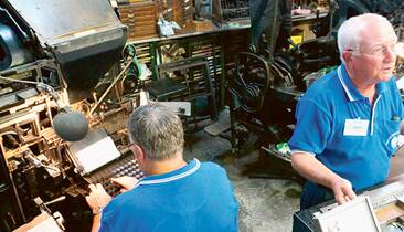 PRINT READY - Penrith Museum of Printing volunteers Steve Boyd and John Berry work on a linotype machine.