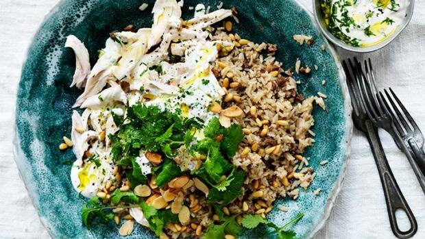 Feast on this: Fragrant poached chicken with spicy, nutty rice. Photo: William Meppe