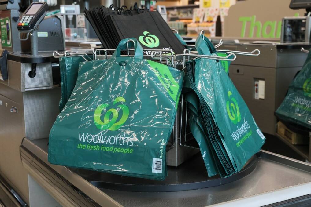 A carousel of shopping bags at a chain supermarket. File picture