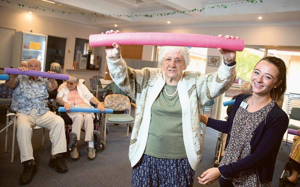 USING HER NOODLE   Betty Coates works out with the help of her therapy partner,  Zoe Jordan.