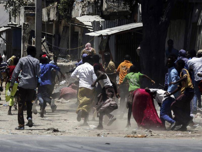 A minister is among the dead as Al Shabaab militants attack a government building in Mogadishu.