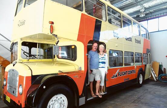 GOOD OLD GIRL – Trevor and Mathilde Carroll with one of the original Top Deck buses used in European tours. It now lives in Gosford, NSW, fully restored and used by some  ex-staff for the occasional nostalgic weekend.