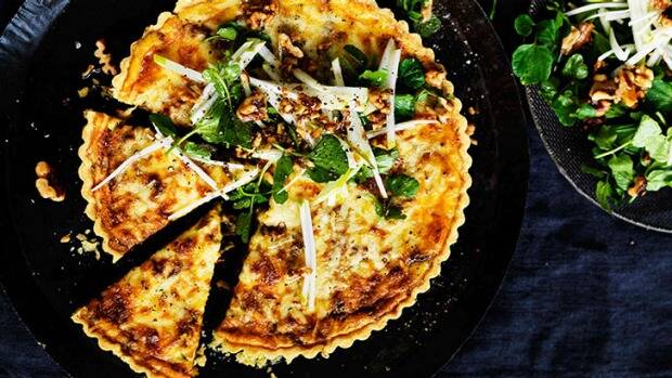 This cheddar-onion tart is a weekend lunch or midweek dinner solution. Photo: William Meppem