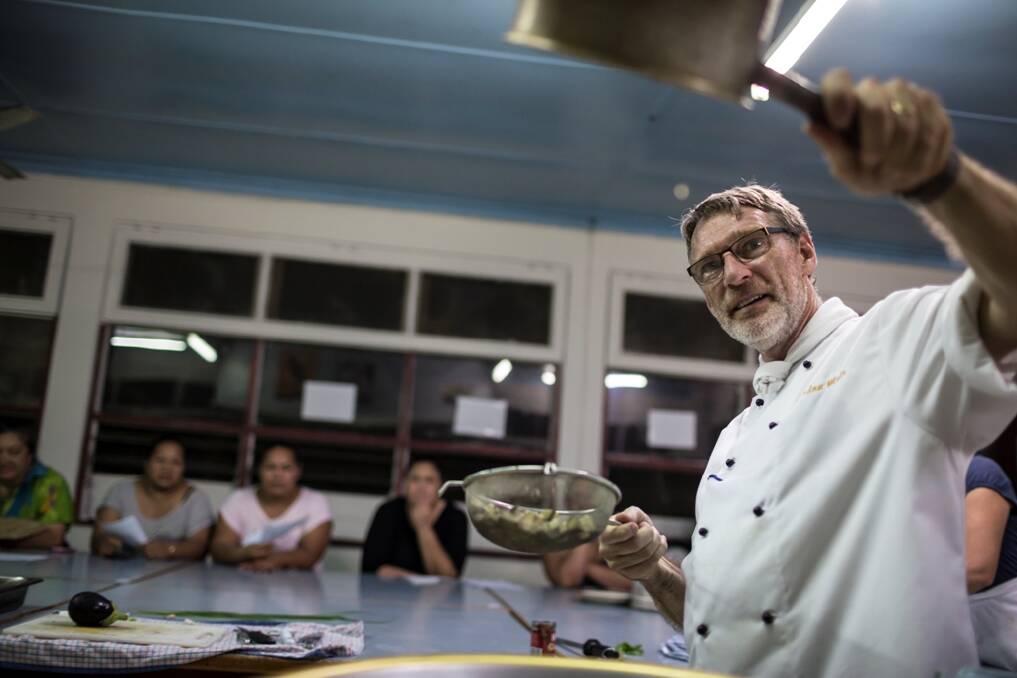 LANGUAGE OF FOOD – Gordon Muir leads a  community cooking class in Tonga  during his year of  volunteering there.