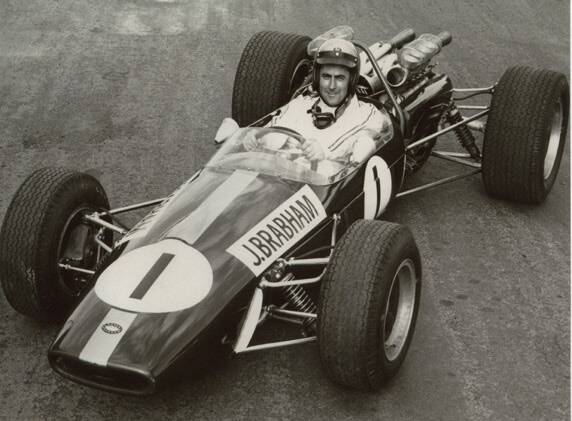 RACE IN TO SEE THIS – Jack Brabham in the 1967 Repco-Brabham BT23A-1v8 racing car, which is now on show in Canberra.