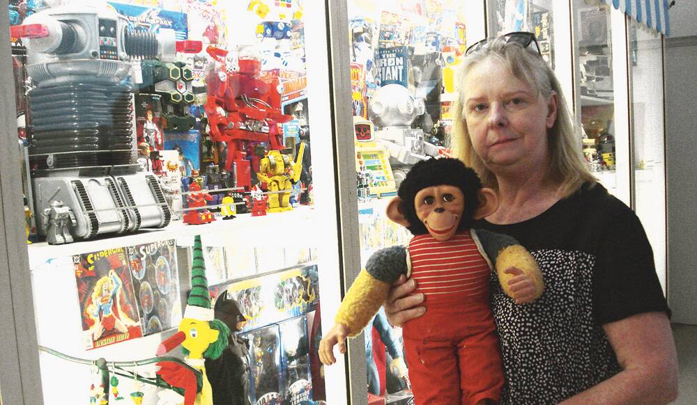 TOY STORIES – Kerry Croft with a vintage Jacko Monkey at the Guildford museum.