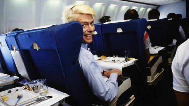 David Bowie over Australia 1983, on a schedule flight rather than private jet. Photo: Denis O'Regan. Ricochet: David Bowie 1983