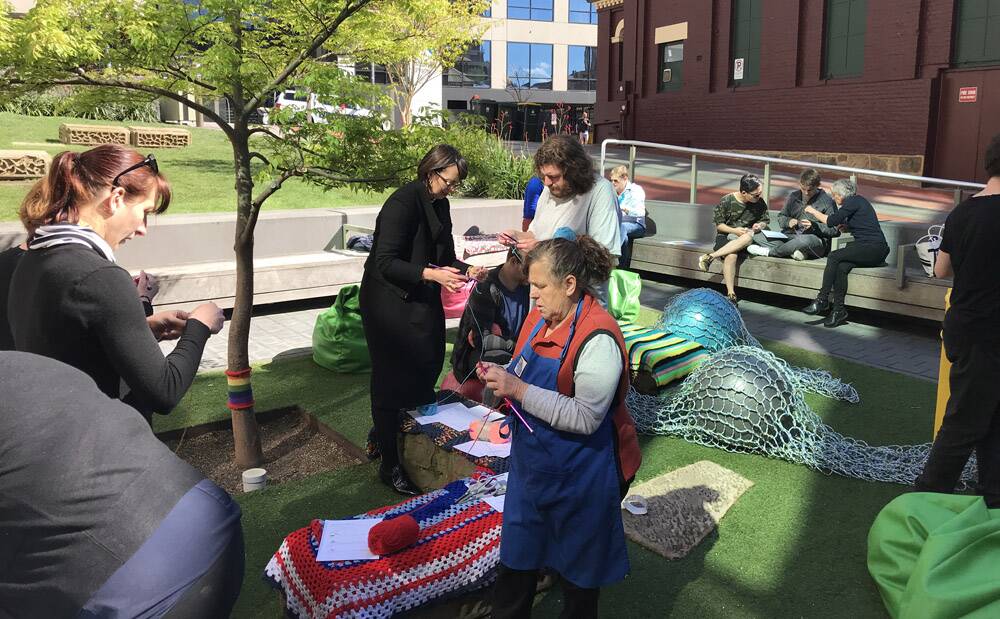 KNIT-IN – Tasmanians young and old form a bond at Commuknitty in Hobart.