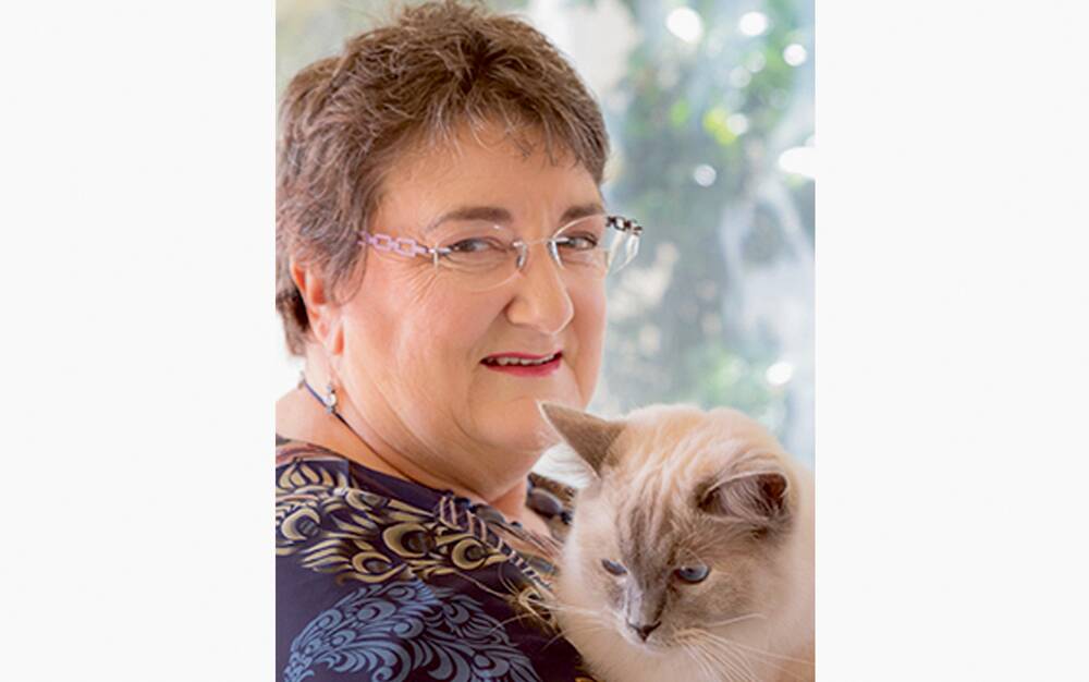 Speaking out - Scam survivor Marshall and her cat Cookie ... "most victims don't get past the shame".