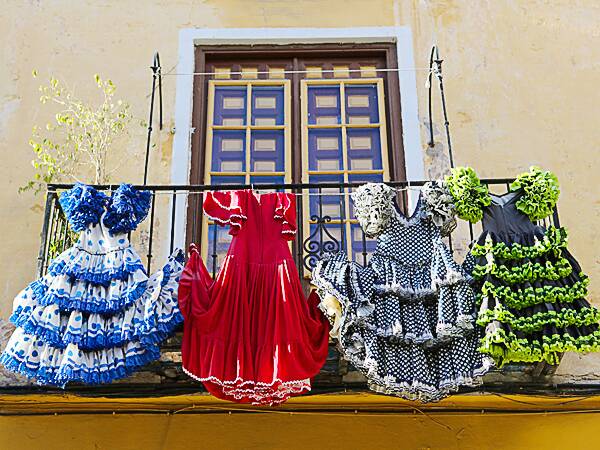 Traditional flamenco dresses at a house in Andalusia. Photo: iStock