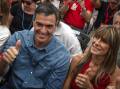 Pedro Sanchez, pictured with his wife Begona Gomez, is staying on as Spain's Prime Minister. (AP PHOTO)