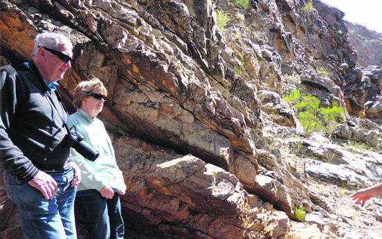Local guides take visitors to remote rock fossil sites.