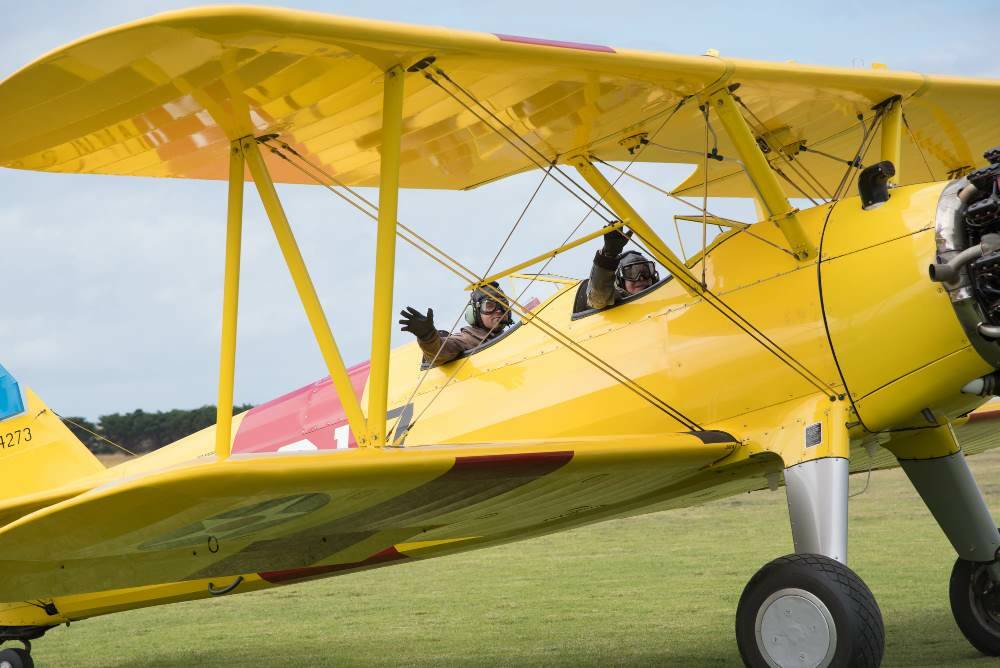 CHOCKS AWAY - Ken Tunley in the biplane with pilot Grant Walsh.