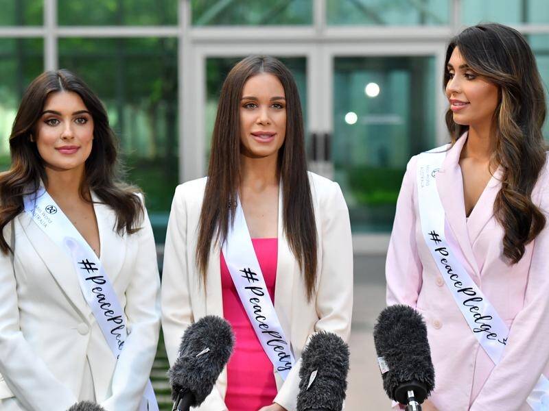 Three Miss World contestants have visited parliament house in Canberra to call for global peace.